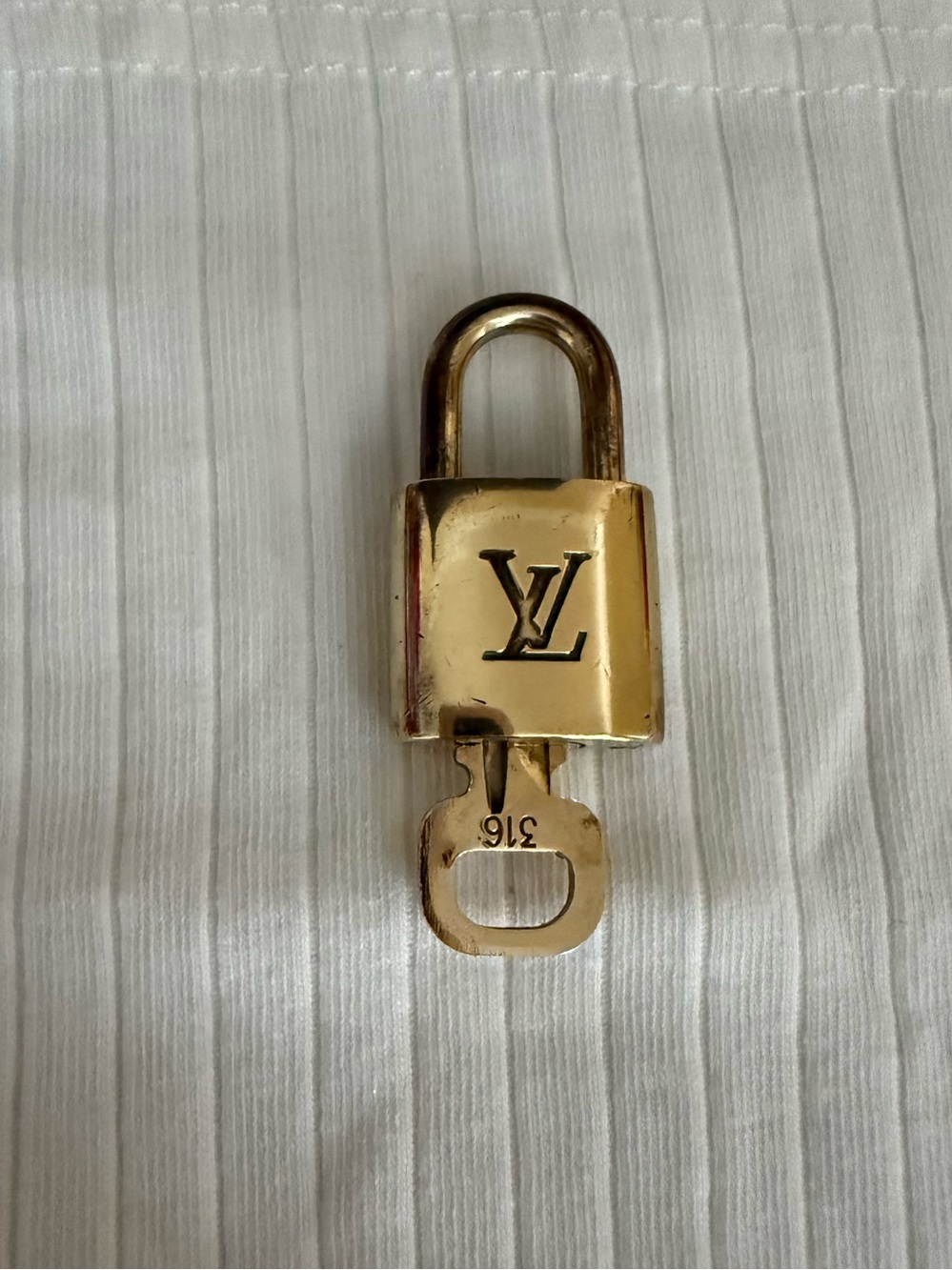 #316 Louis Vuitton Gold-Tone Padlock and Key Set